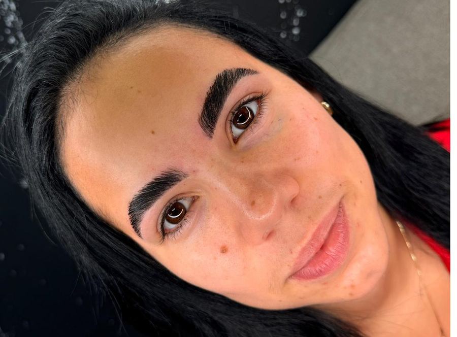 Client smiling after her brow appointment